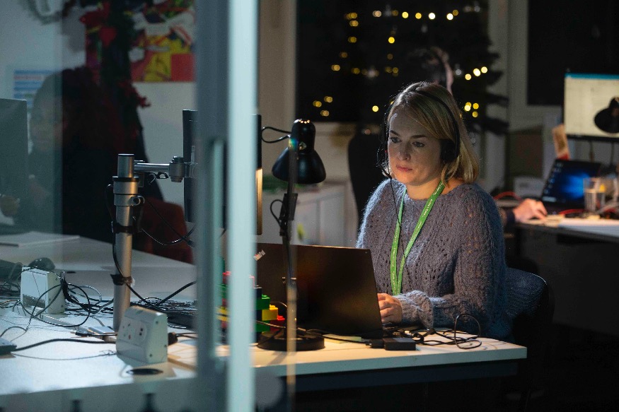 Volunteers get ready to answer calls from children at Christmas