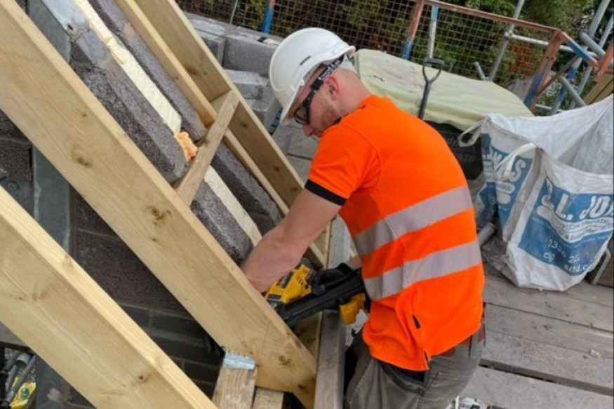 Young people building construction careers thanks to college